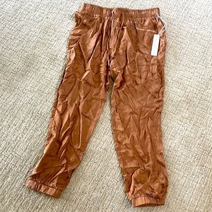 Women’s gold/bronze silk material jogger - Size L